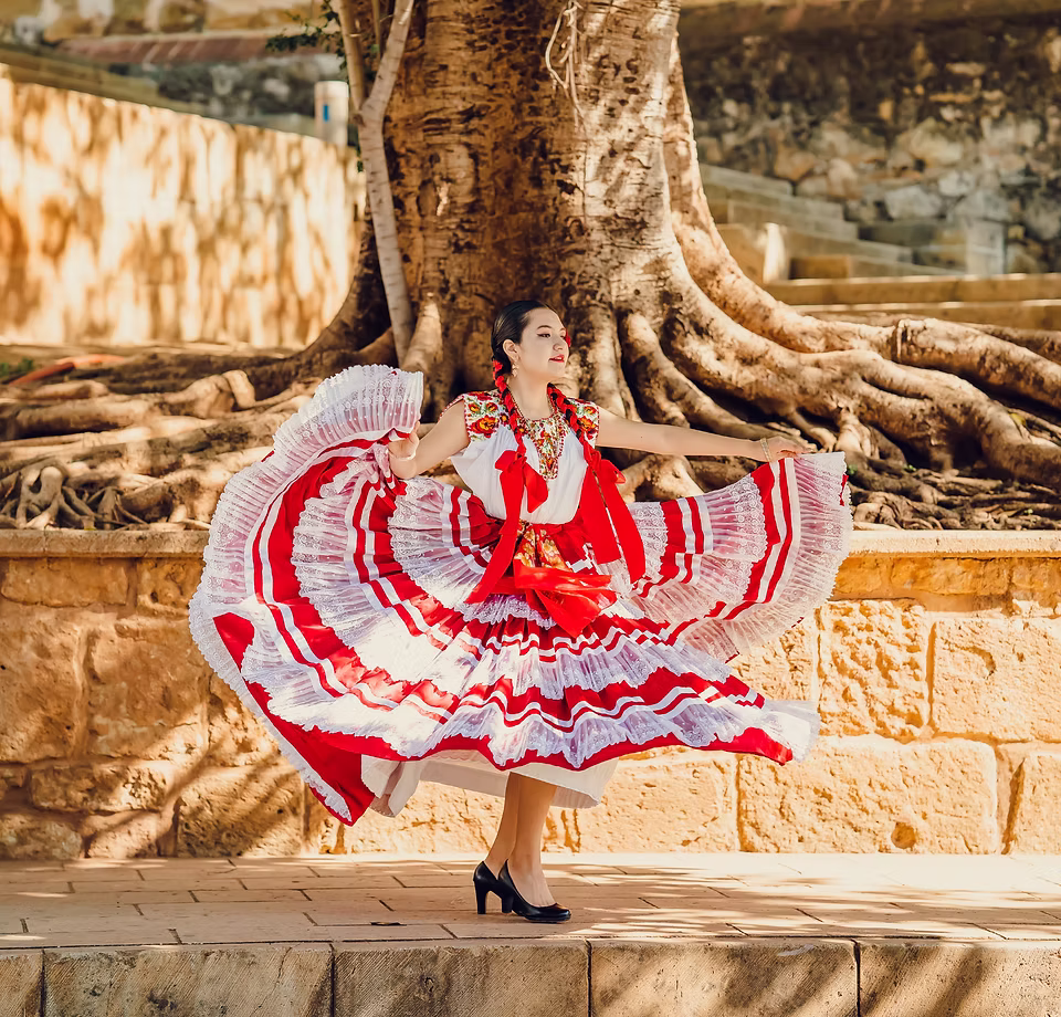 Young woman in traditional red Ballet Folklorico dress performing cultural dance