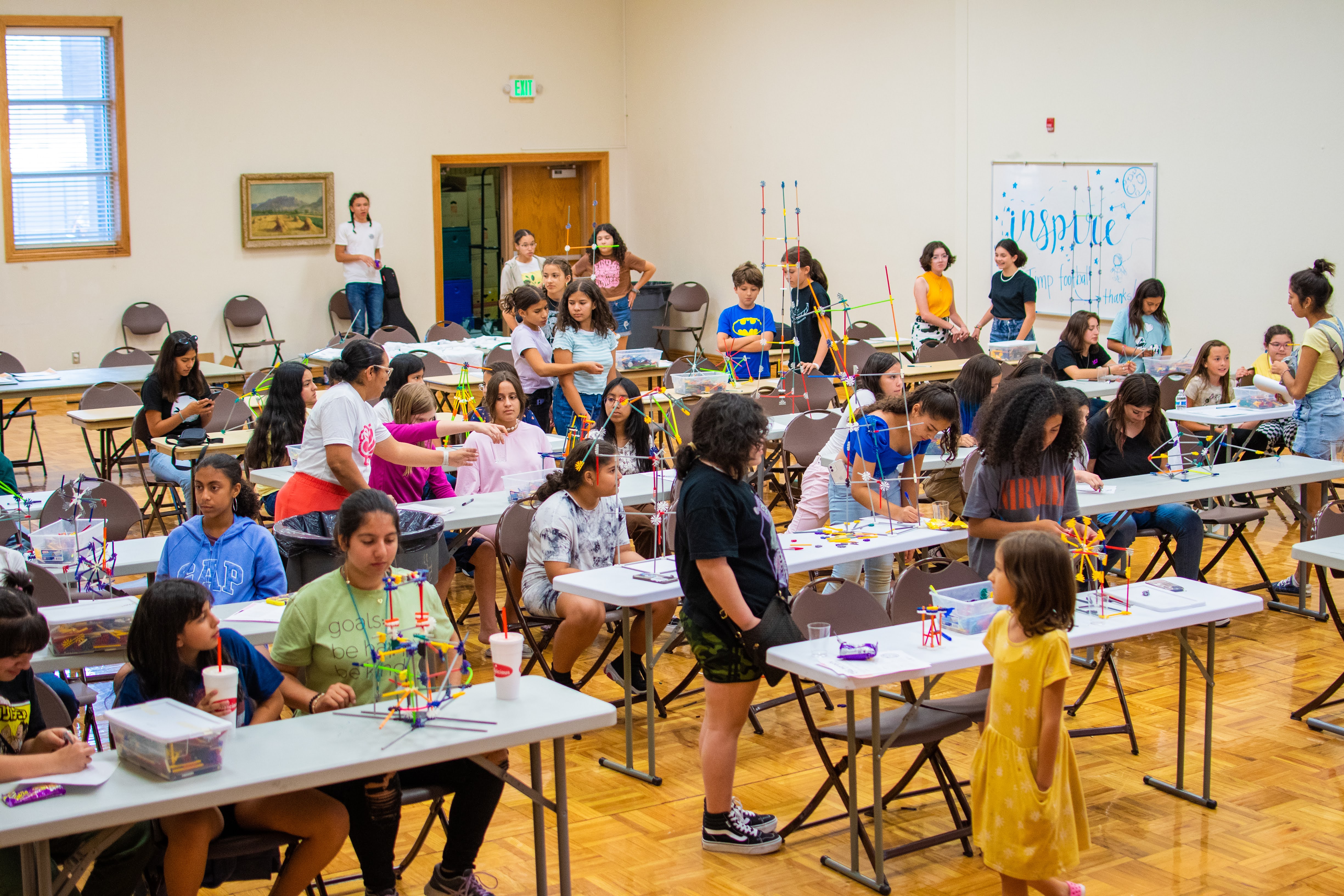 Students in a classroom setting, focused on educational activities